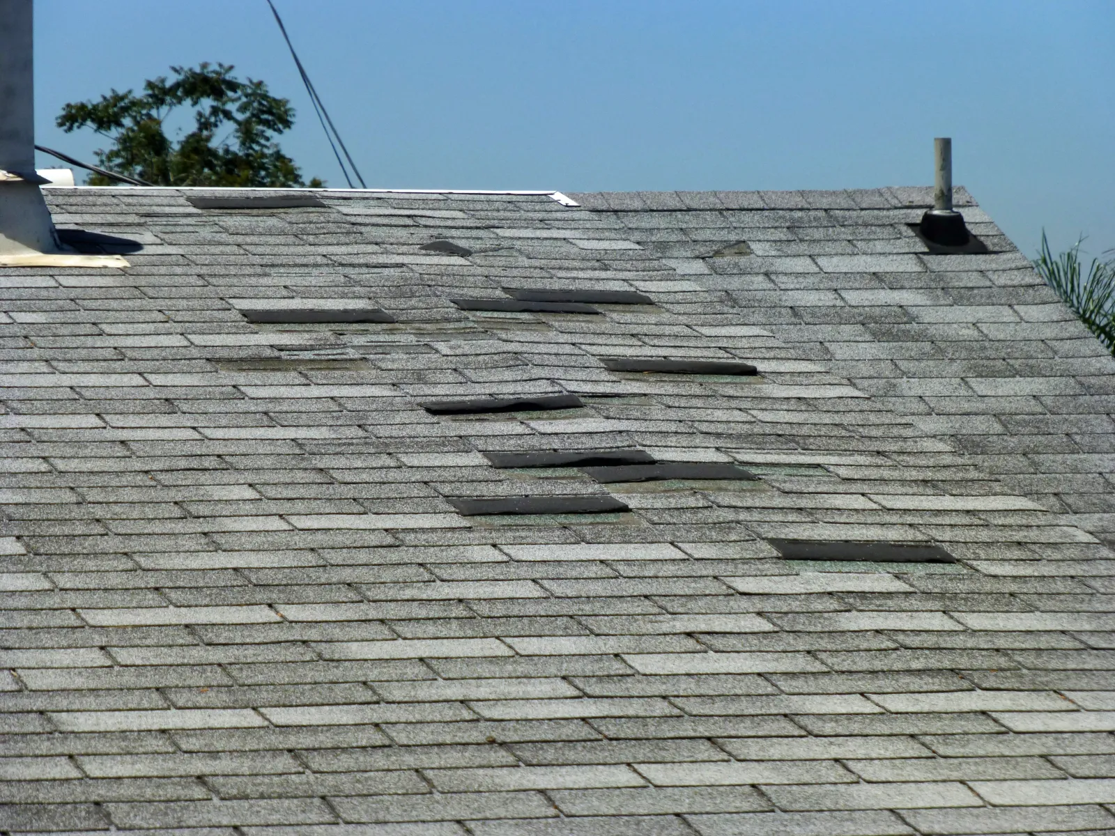 Missing shingles on a residential roof in Middle Georgia after a hail storm